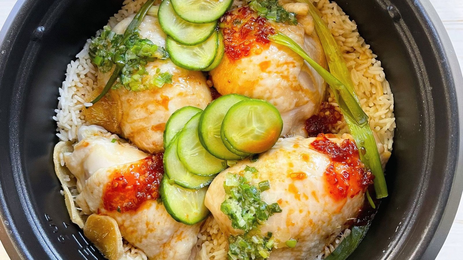 Chicken and rice simmering in a slow cooker, illustrating an easy and comforting meal option.