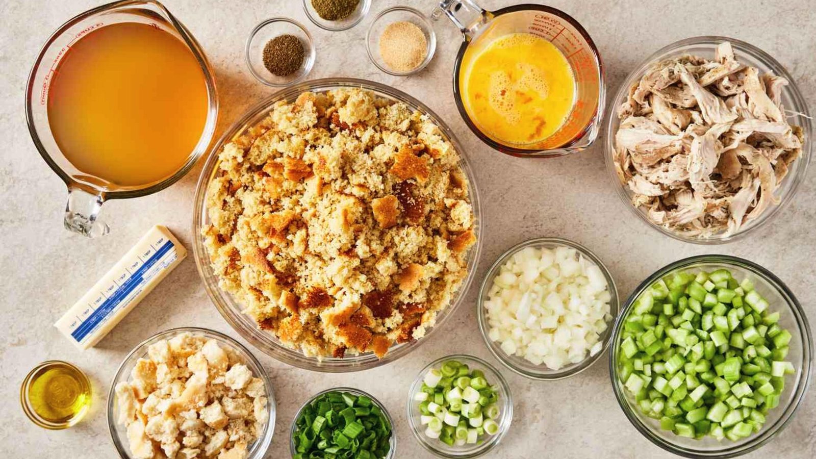 Bowls filled with ingredients for a Southern chicken casserole, ready for preparation.