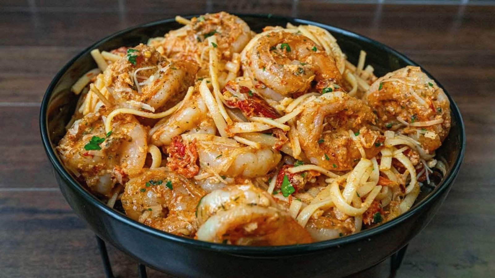 A serving of pasta with shrimp and crab, highlighting a flavorful seafood meal option.