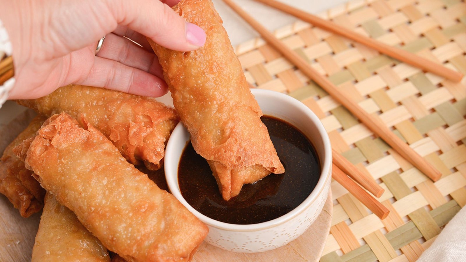 Crab egg rolls served with a variety of dipping sauces, ideal for improving flavors and enjoyment.