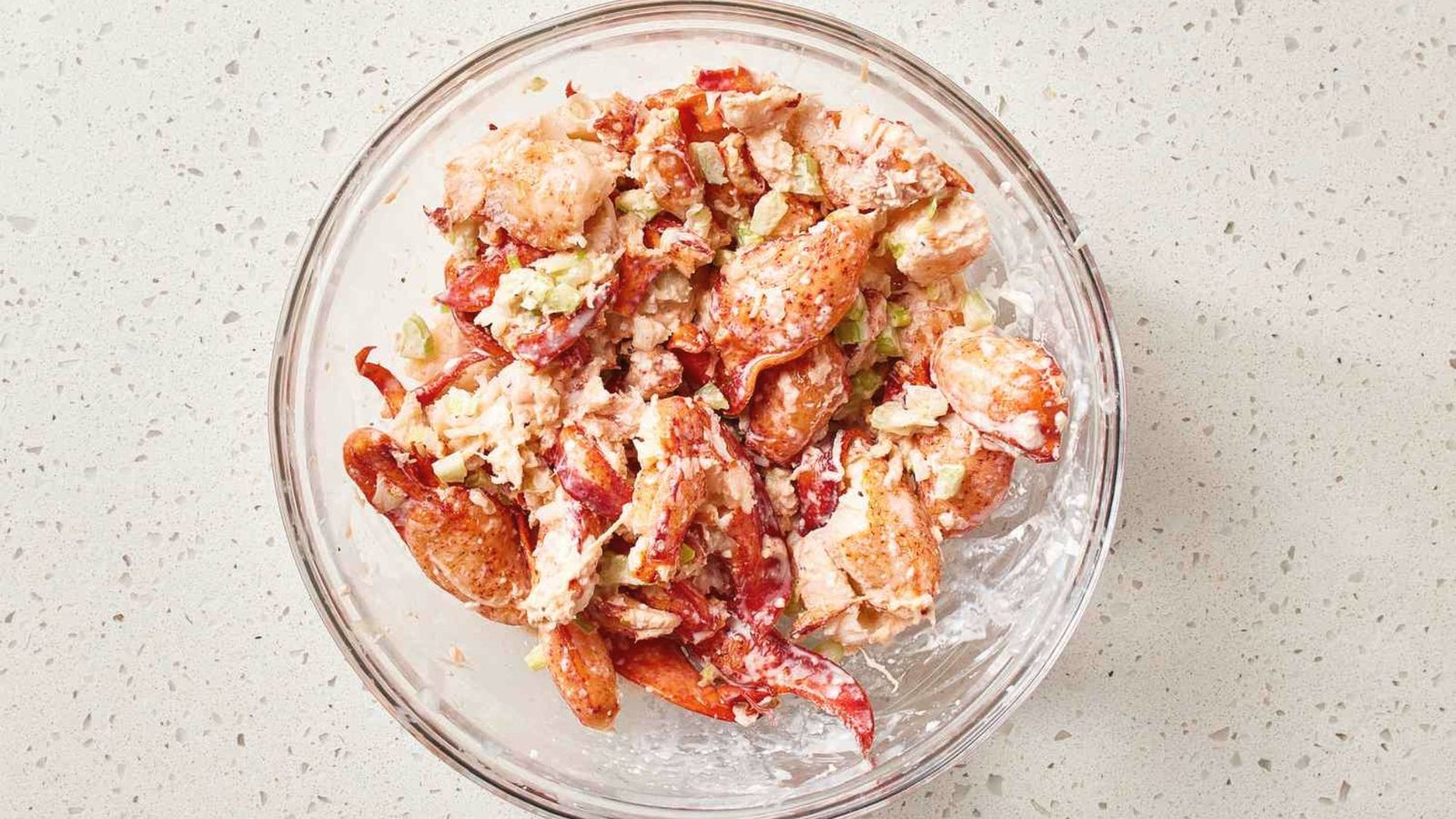 A bowl filled with seasoned lobster bites.